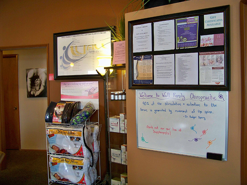 Photo of Wall Chiropractic bullitan board with announcements and information.